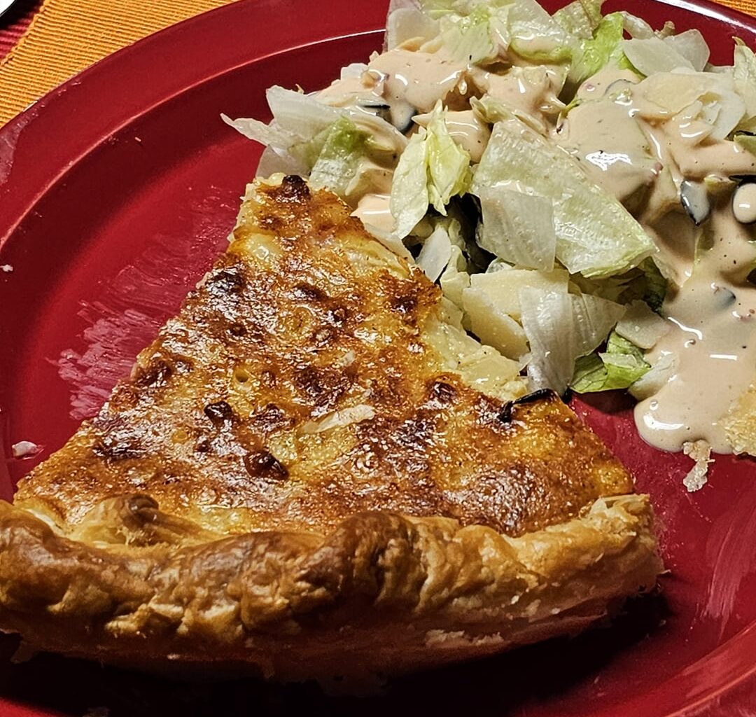 Cheese and onion Wähe with a side salad