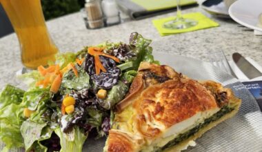 Homemade spinach quiche with goat's cheese and mixed salad, served in Allensbach (Germany)