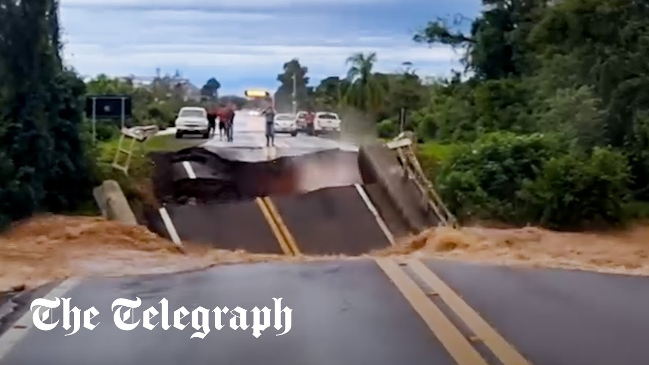 Brazil floods: Man narrowly avoids death after motorway bridge collapses