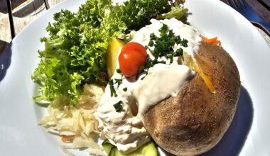 Hot jacket potato with sour cream and mixed salad