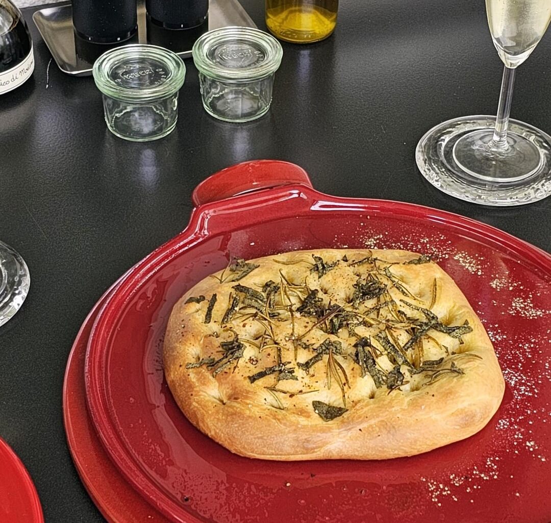 Focaccia made from leftover pizza dough (in addition to the obligatory rosemary, we also like to add a little sage)
