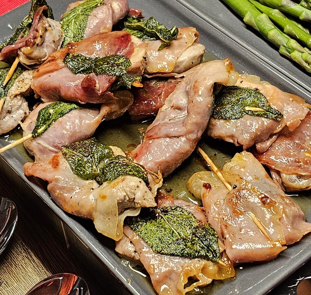 Saltimbocca with early potatoes roasted with thyme, rosemary and sage fresh from the garden, and green asparagus