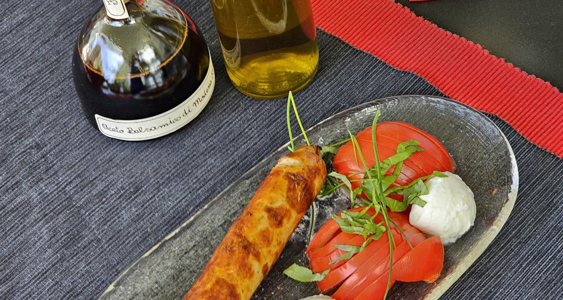 Rostbratwurst (grilled sausage), with what we affectionately call Tomazella (tomatoes with mozzarella di bufala)