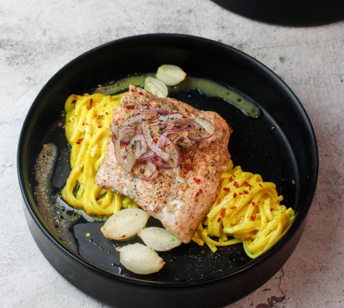 Trout & pearl onions cooked en papillote with beurre blanc & white wine served on a bed of pasta in a mustard & lemon sauce