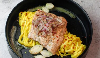 Trout & pearl onions cooked en papillote with beurre blanc & white wine served on a bed of pasta in a mustard & lemon sauce