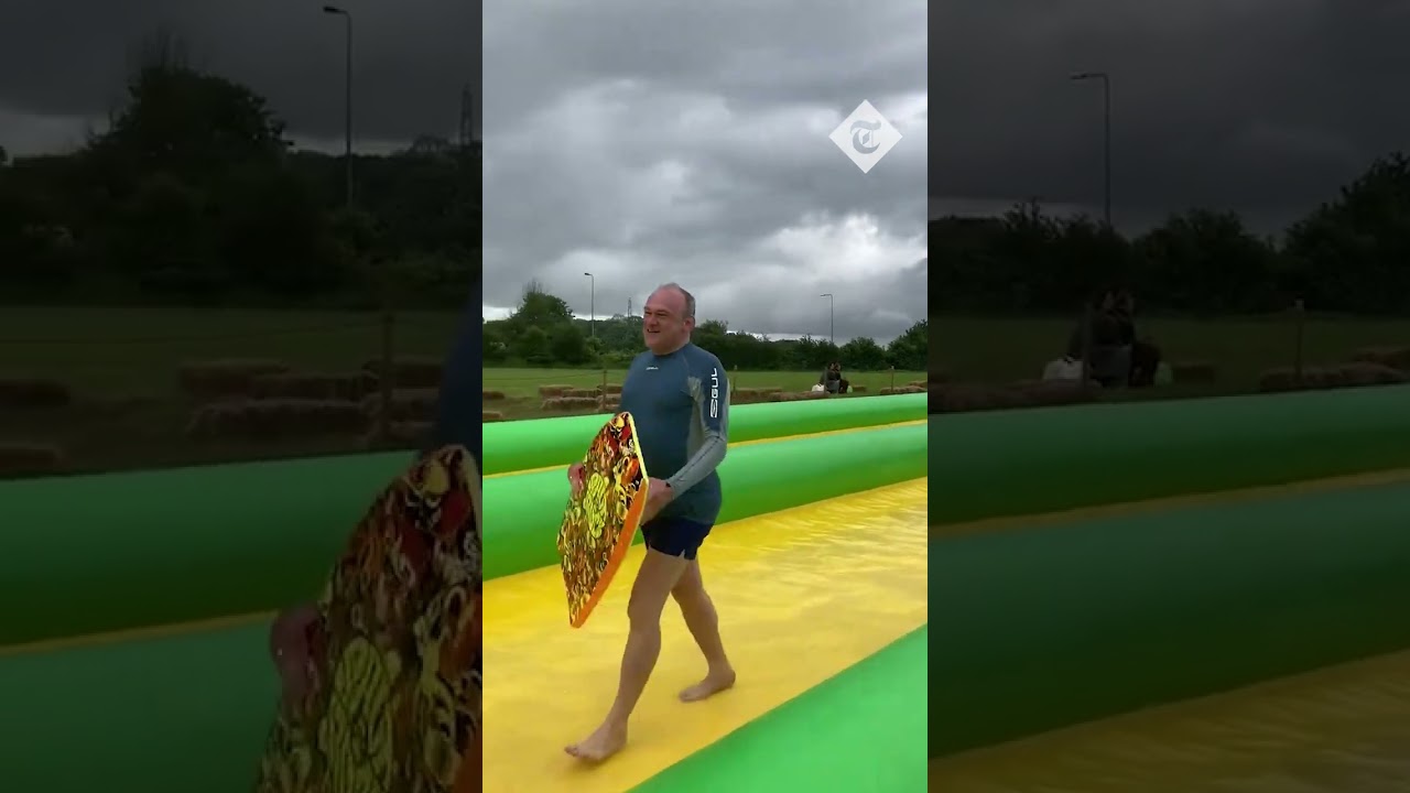 "Lib Dems are go!": Ed Davey blitzes down a waterslide in Somerset