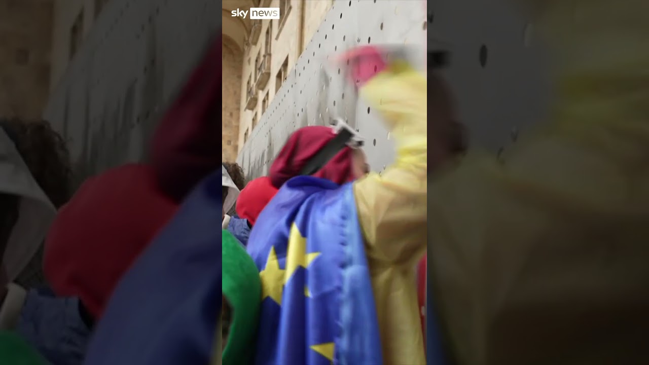 Protesters break through Georgian parliament barricades