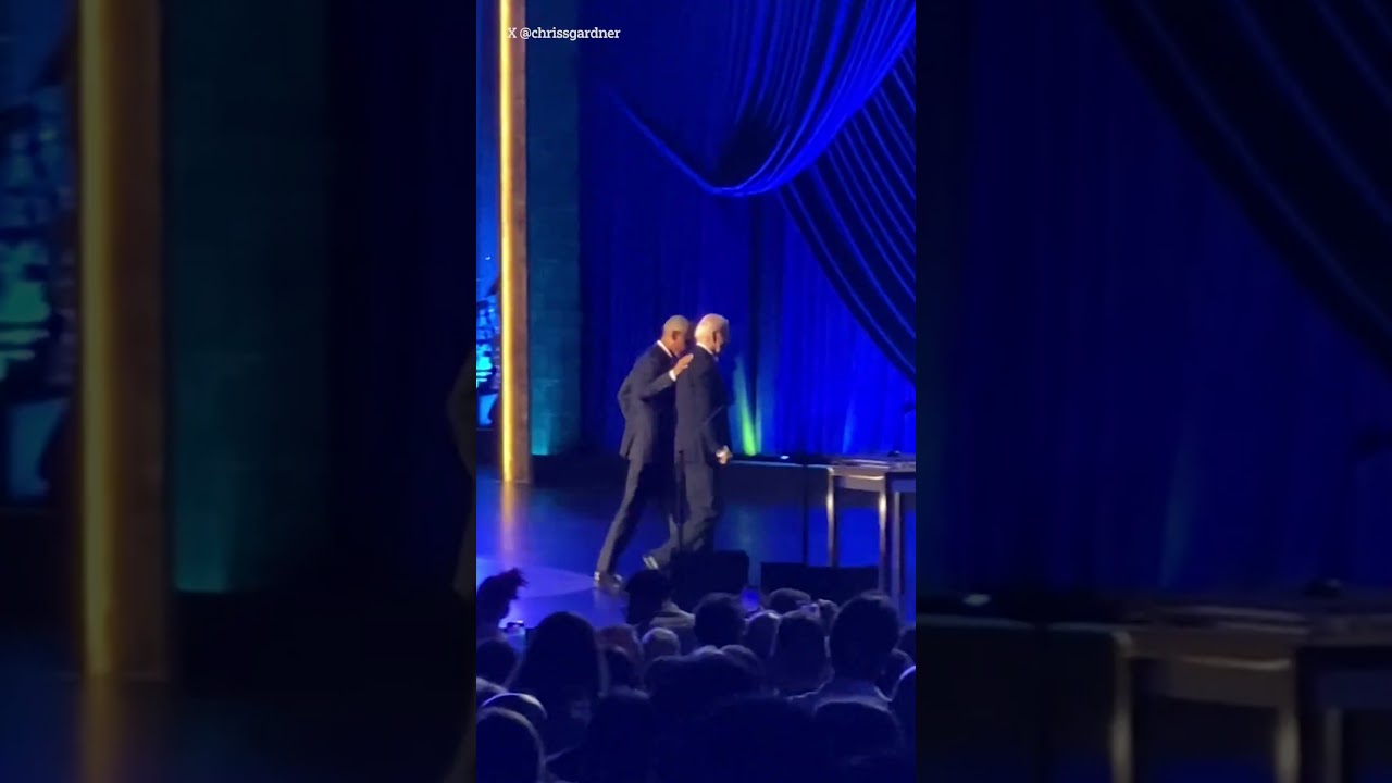 US President Joe Biden appears to freeze again, before Barack Obama helps him off-stage