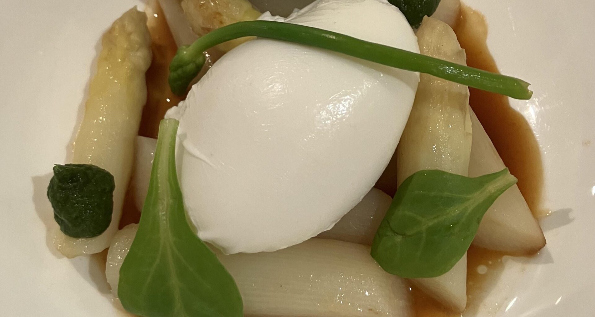 White asparagus with a poached egg