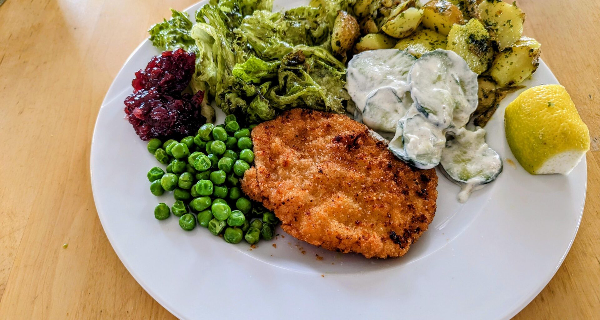 Wiener Schnitzel (homemade) with parsley-potatoes, green salad with Kernöl and lots of green vegetables