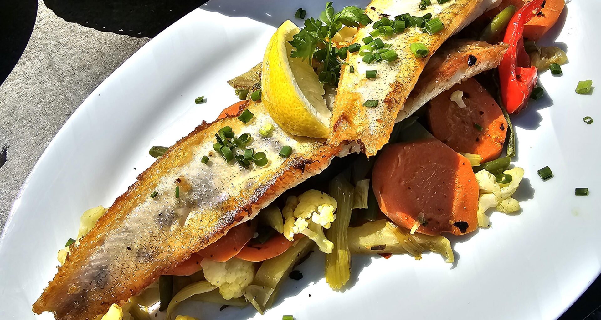 Grilled zander fillets on vegetables (carrots, cauliflower, courgettes, green beans and peppers), Lake Constance, Germany