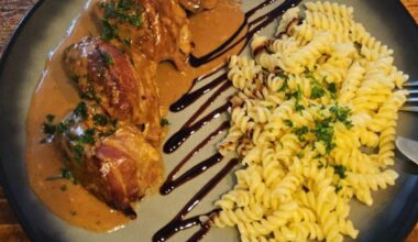 Meatballs with mozzarella filling, wrapped in bacon. Cream sauce. Noodles tossed in a bit of butter and herbs.