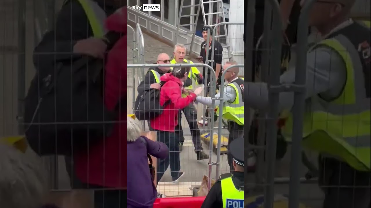Reform UK leader Nigel Farage dodges objects thrown by protester