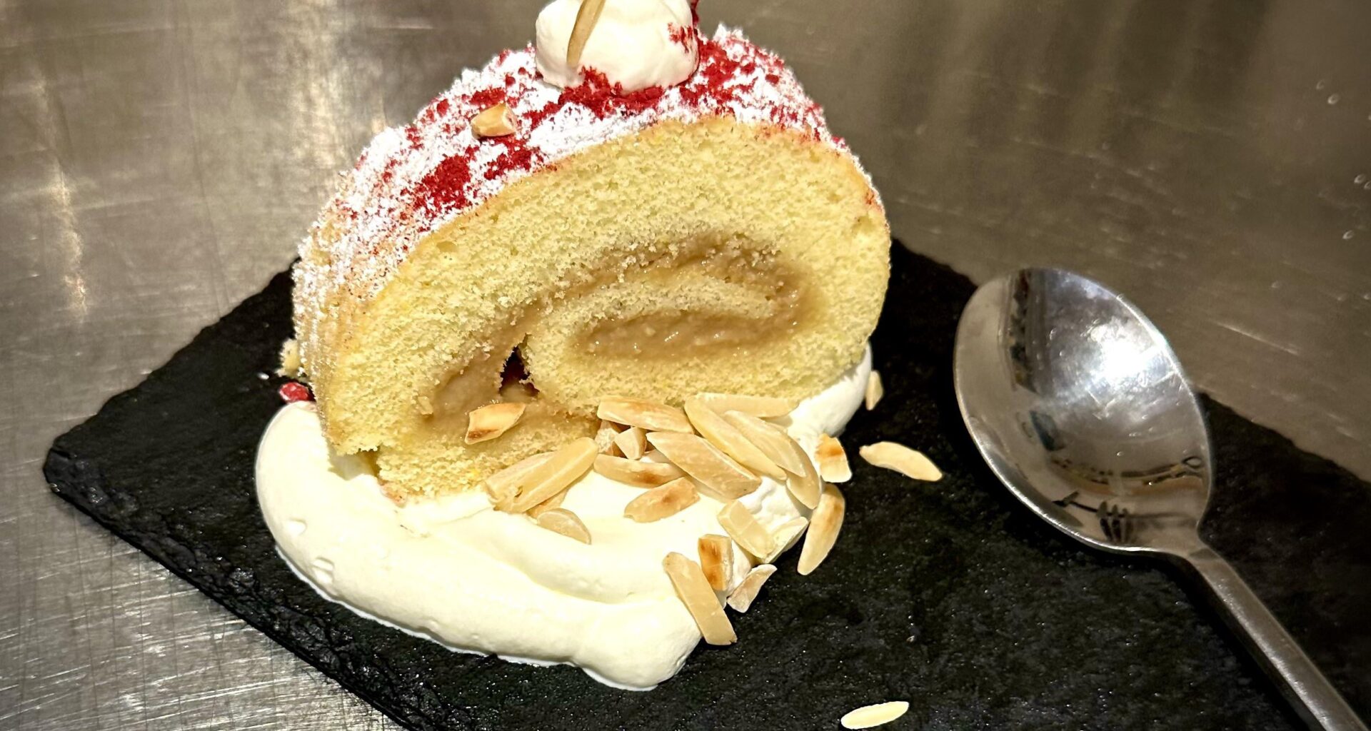 Banana Butter vanilla roulade with sweet whipped cream & toasted almonds