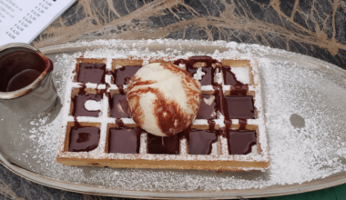 Belgian waffle with warm chocolate sauce in Bruges