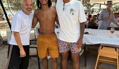 Nathan Aké and Manuel Akanji posing for a photograph with a fan on their holidays