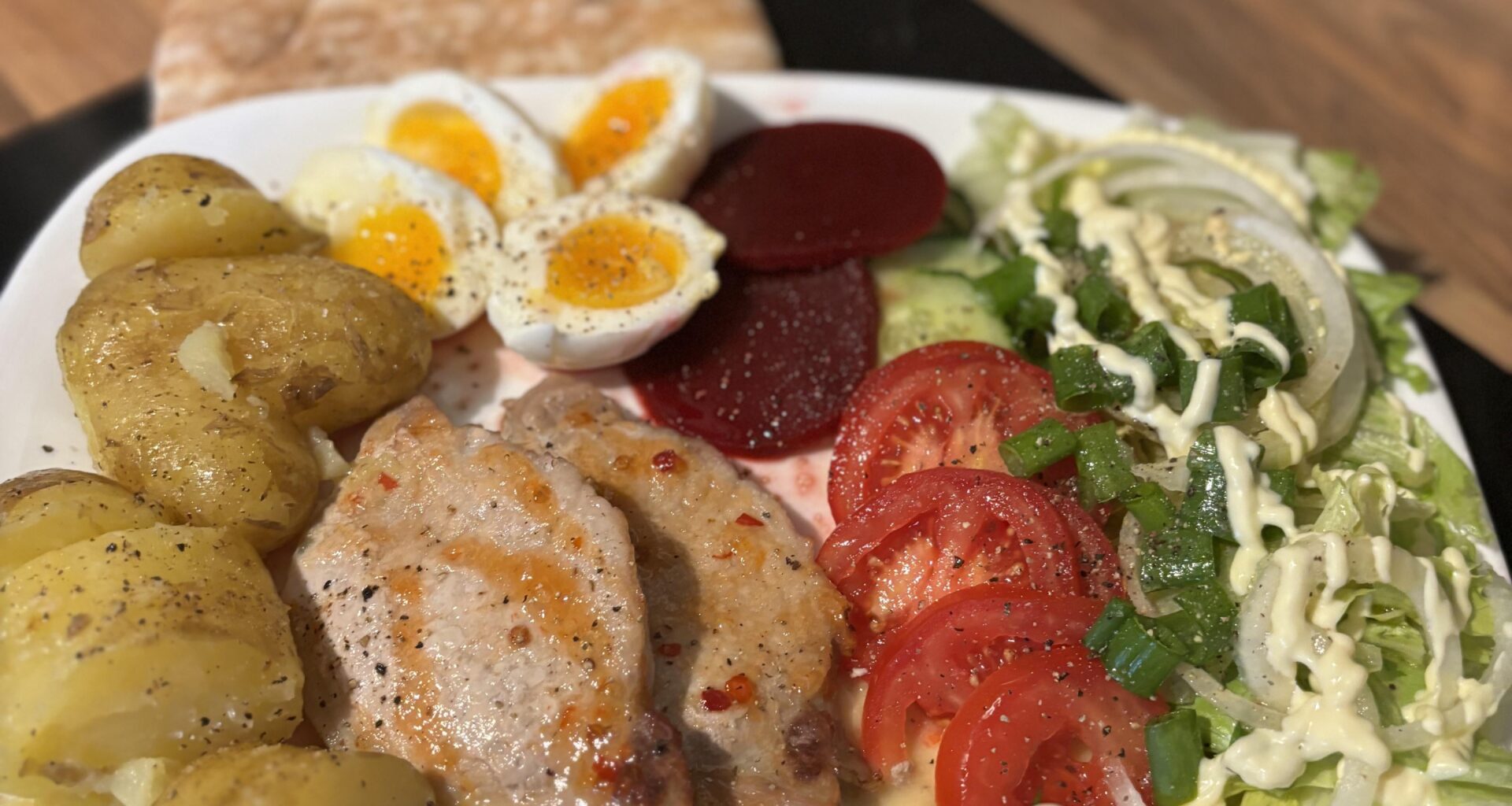 pork loins with buttery jersey potatoes and salad