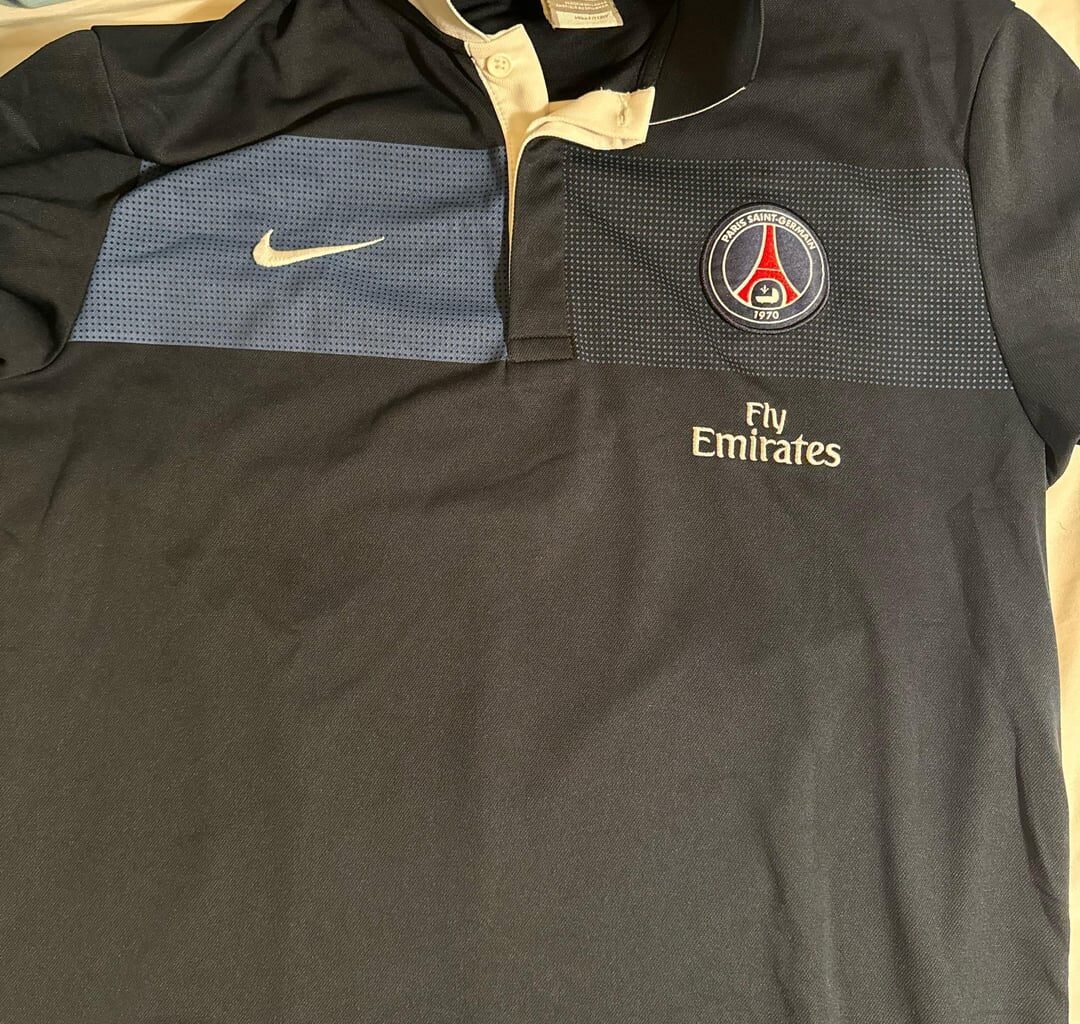Please help me identify this Nike polo
