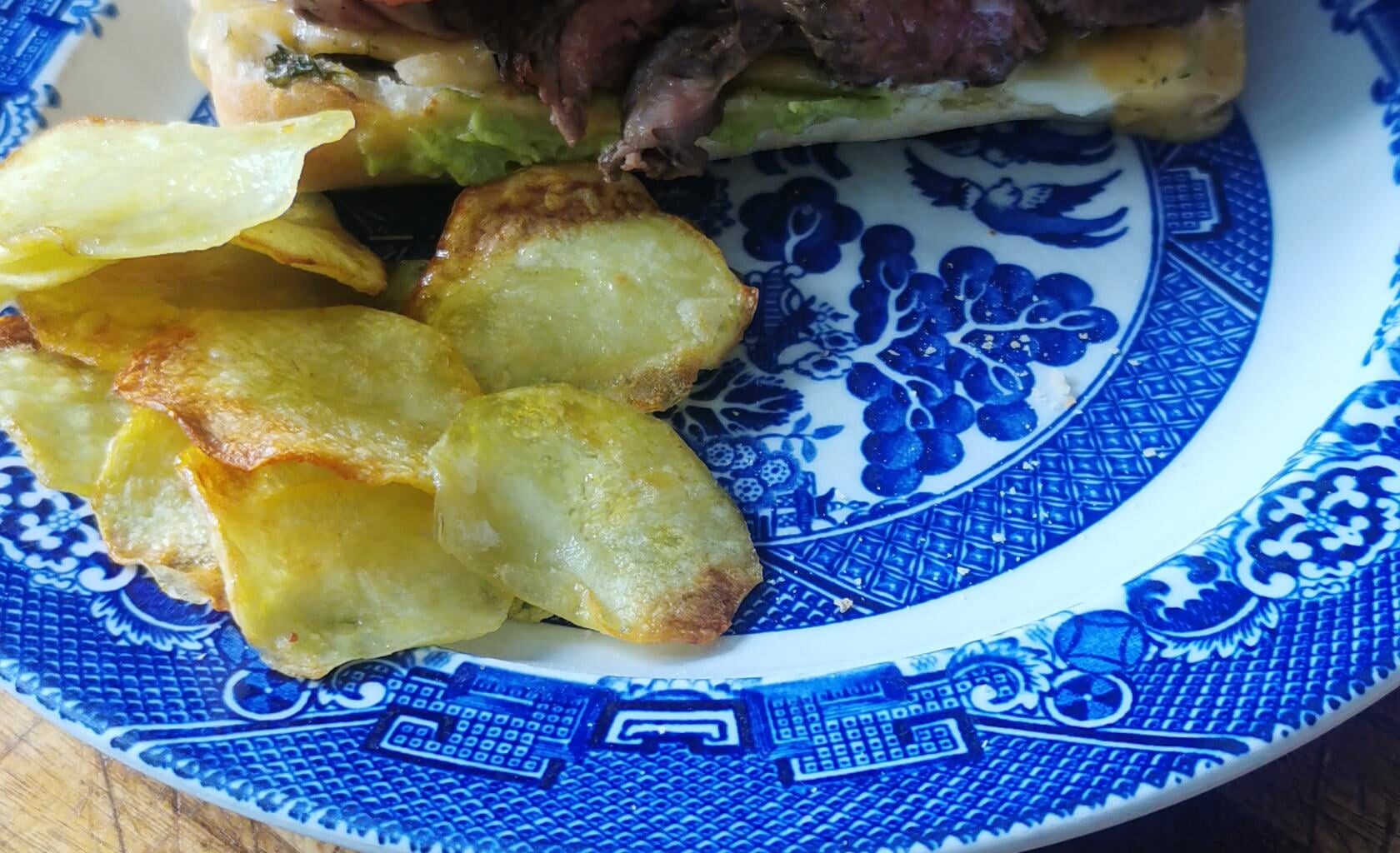 [Homemade] beef panini with chimichuri, smashed avocado with lime, tomato, crispy onions, double Gloucester with chive cheese and homemade potato crisps