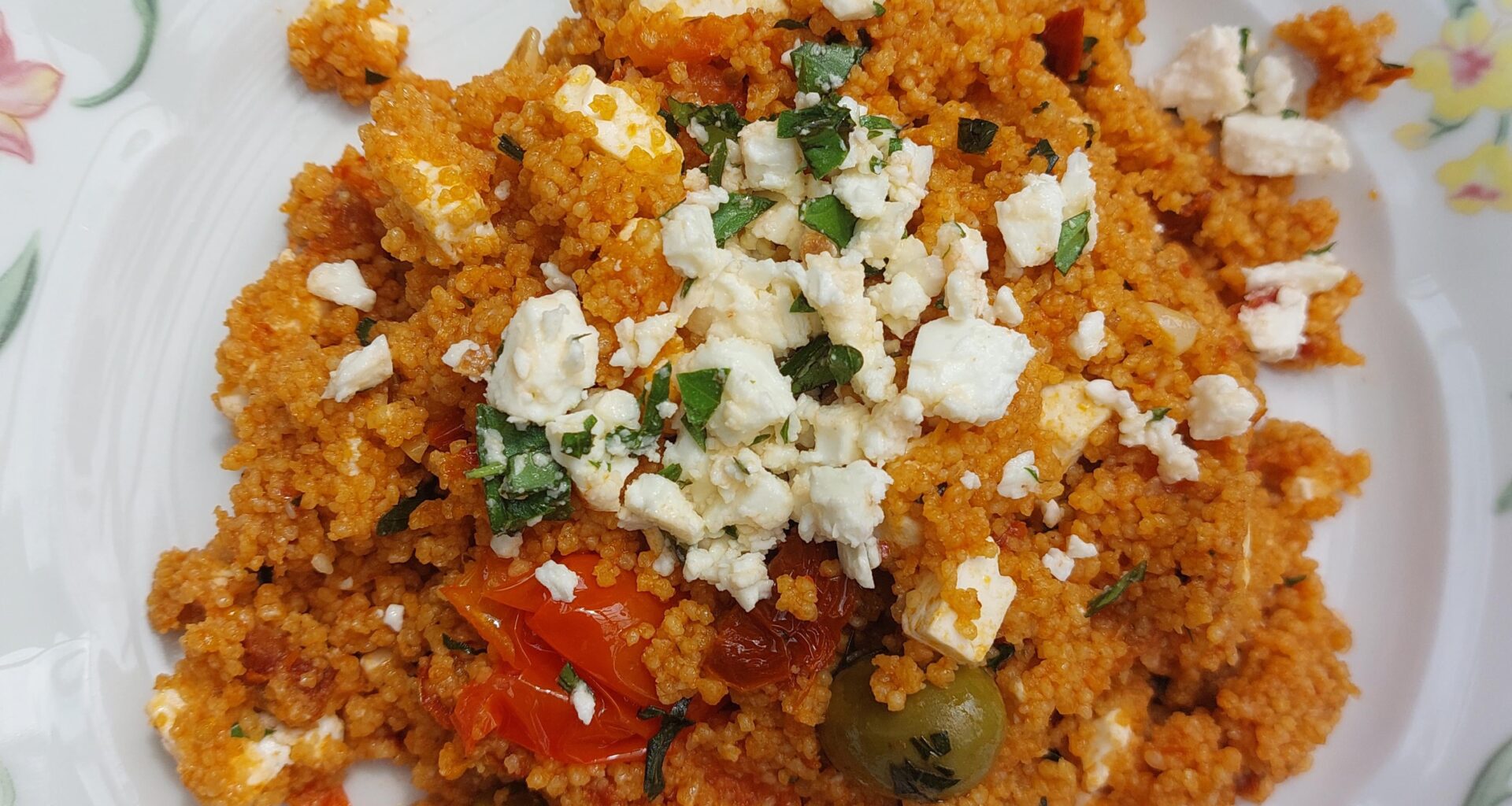Tomato couscous with feta, olives and basil.