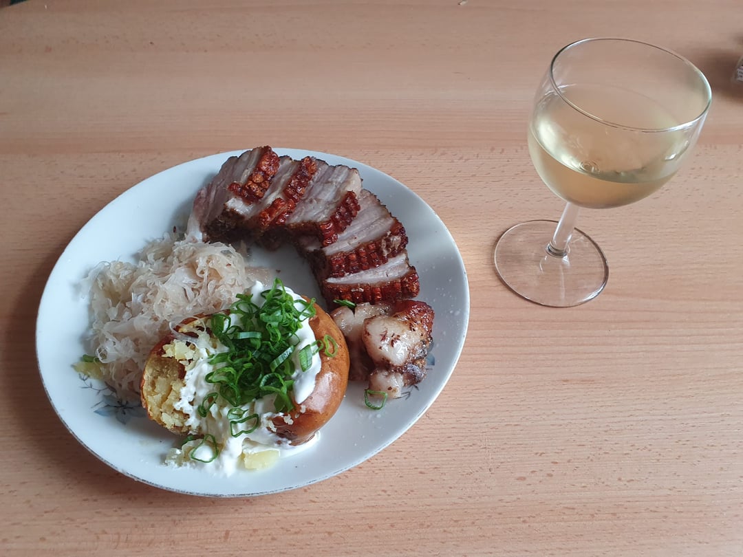 Roasted pork belly with baked potato and sauerkraut
