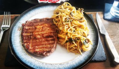 [Homemade] ribeye steak medium, finished with garlic butter, spinach and mushroom spaghetti finished with cream, tomato, mozzarella and truffle oil sauce