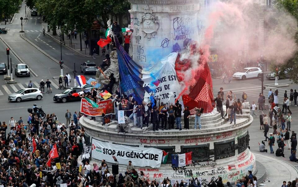 Voters turn out in force to keep hard-Right National Rally from running country, with New Popular Front predicted to win