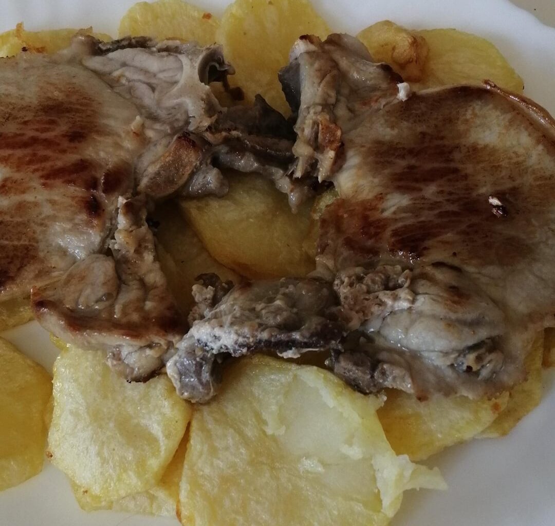 Pork chops and fried potatoes for lunch