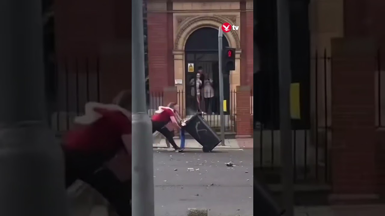 Middlesborough women charging burning wheelie bin into police falls down #shorts