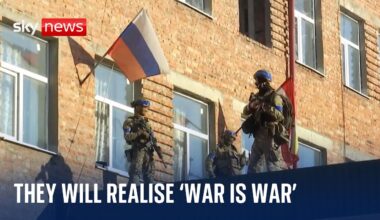 Captured rifle and roubles, Ukrainian soldiers show off "trophies" from Russian incursion