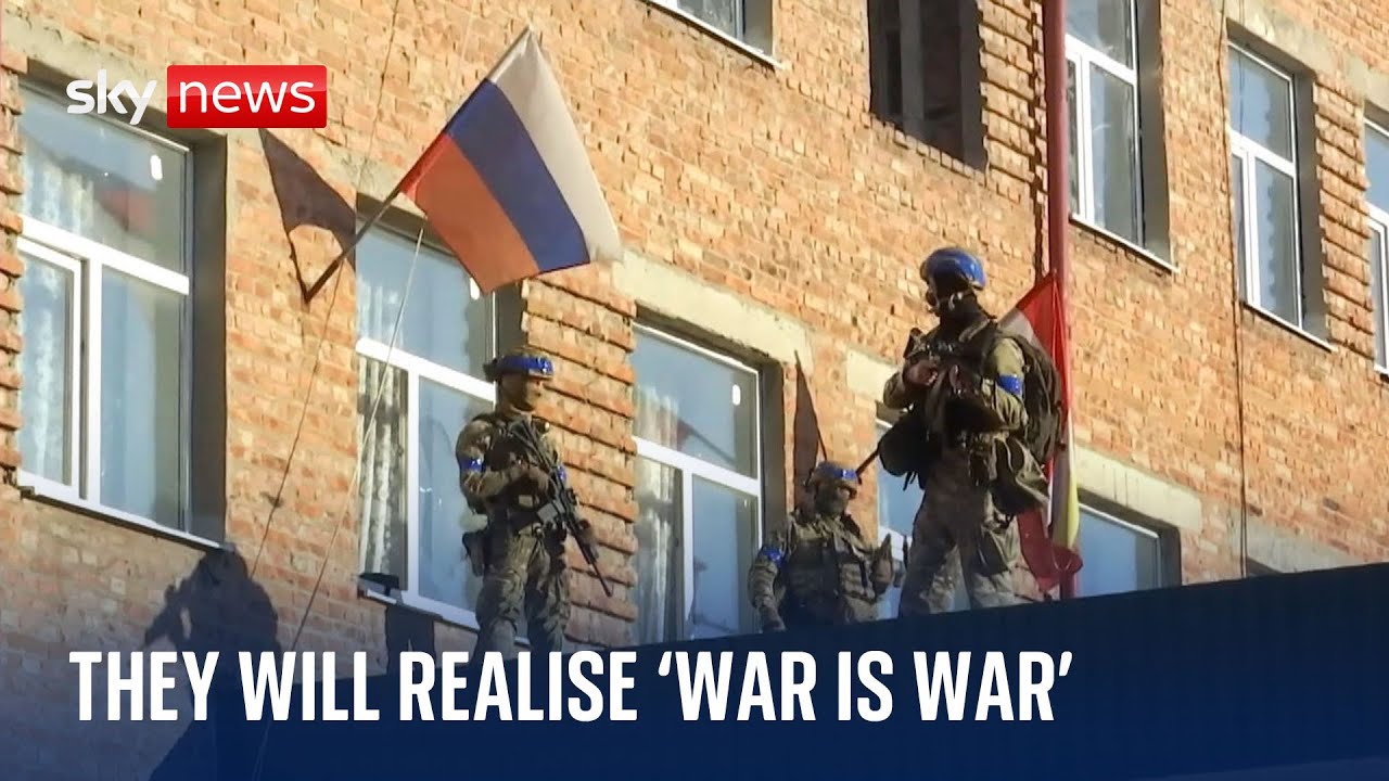Captured rifle and roubles, Ukrainian soldiers show off "trophies" from Russian incursion