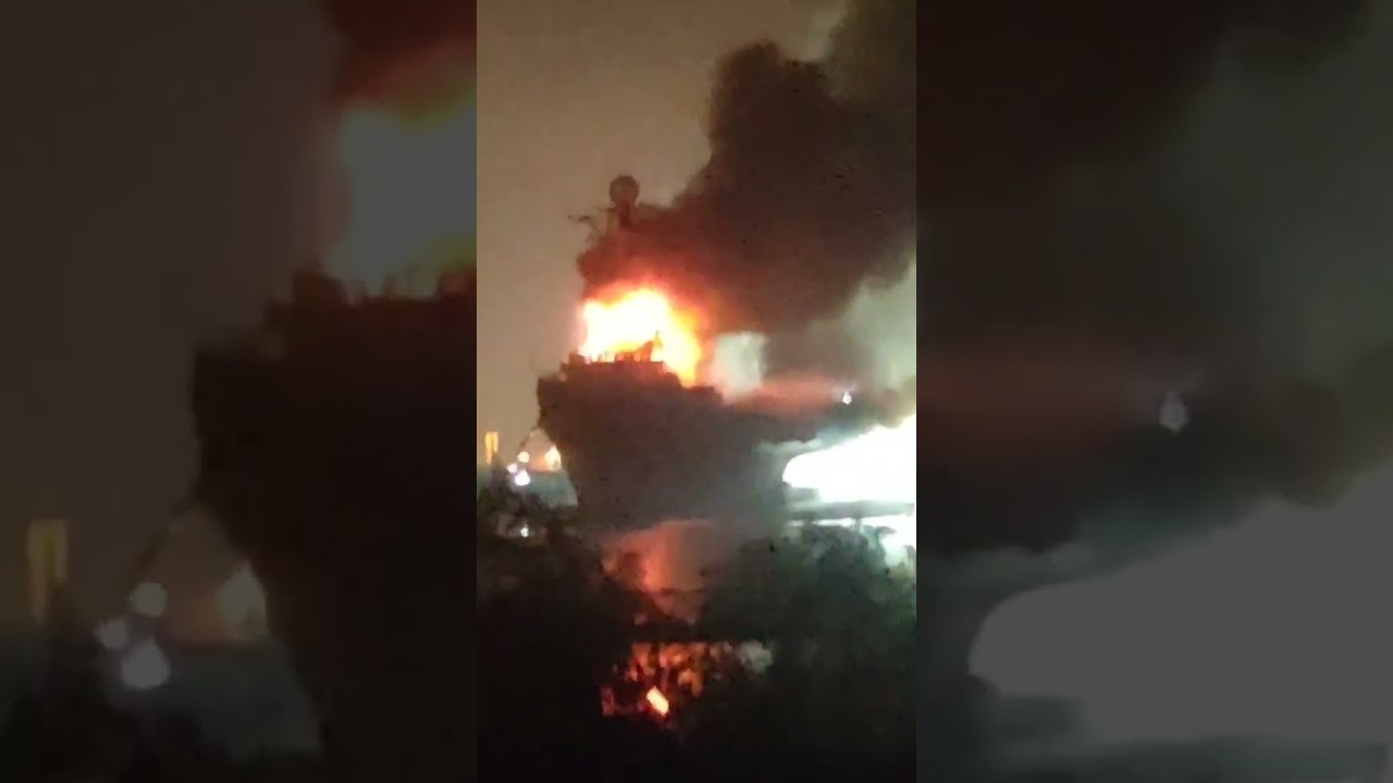 Soviet aircraft carrier on fire in Chinese lagoon