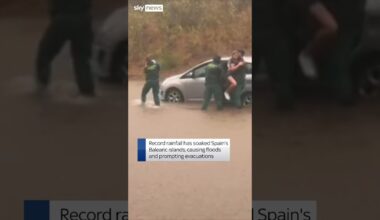 Family rescued from car in flood-hit Spain