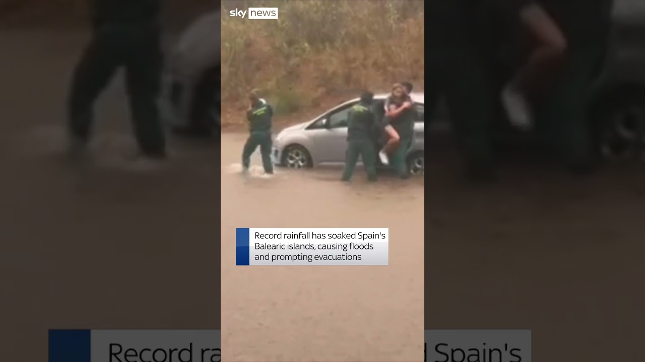 Family rescued from car in flood-hit Spain