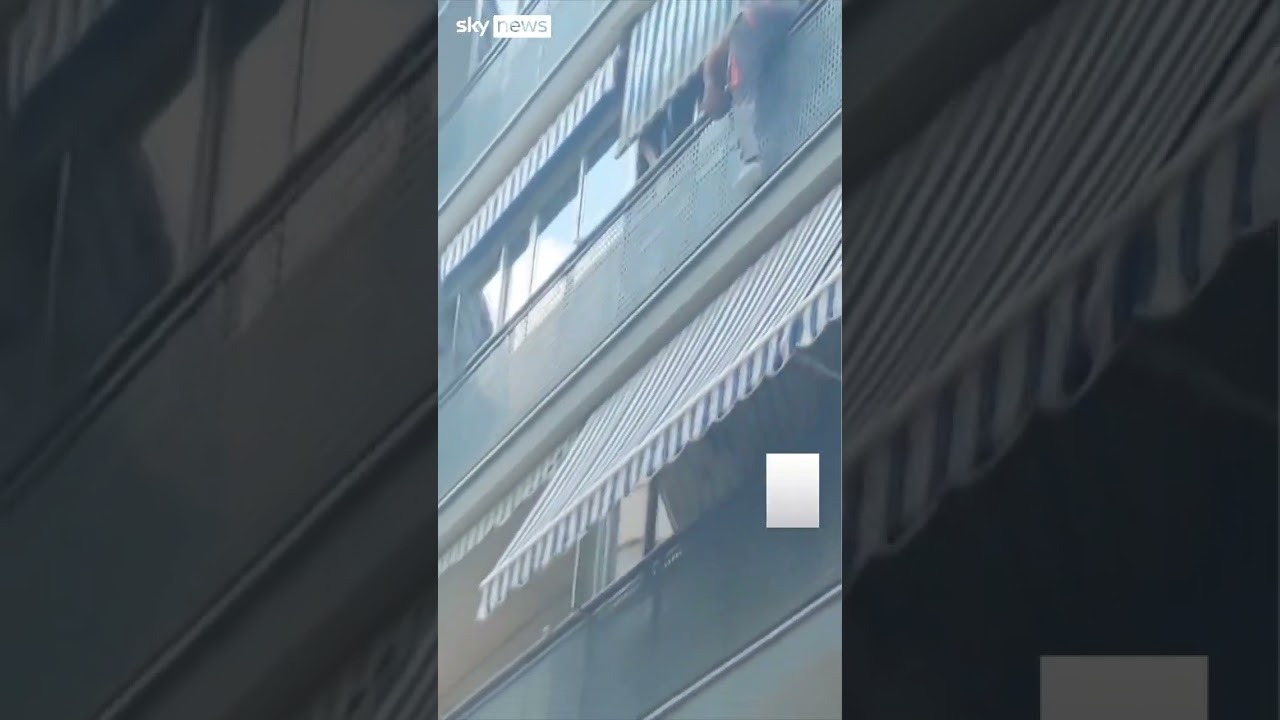 Bricklayer rescues boy hanging over balcony