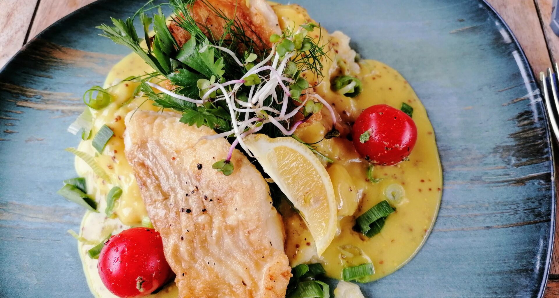 Cod with mashed potatoes on sweet mustard sauce
