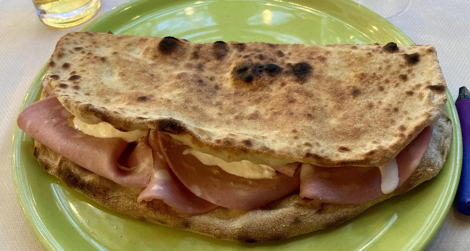 Open calzone, with mortadella, stracciatella and lemon zest!