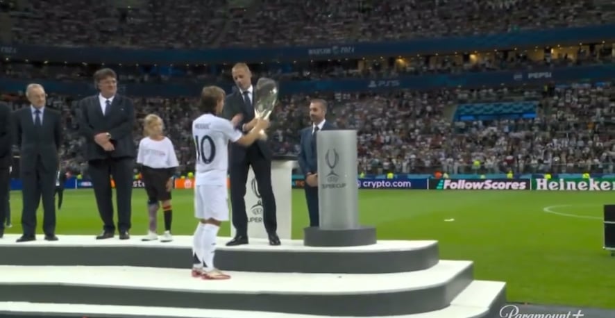 Luka Modrić lifts the UEFA Super Cup trophy, becoming the most decorated player in Real Madrid history with 27 trophies.