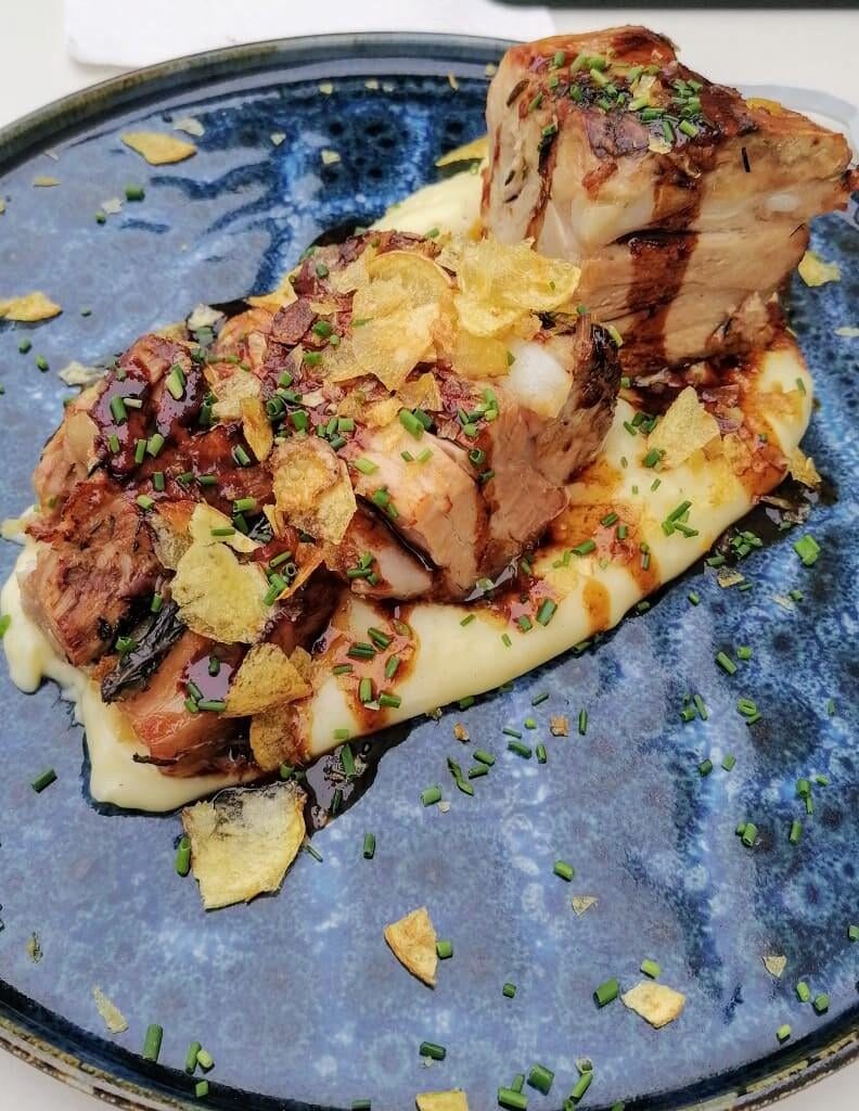 Pork Belly with apple cider gravy on mashed Potatoes