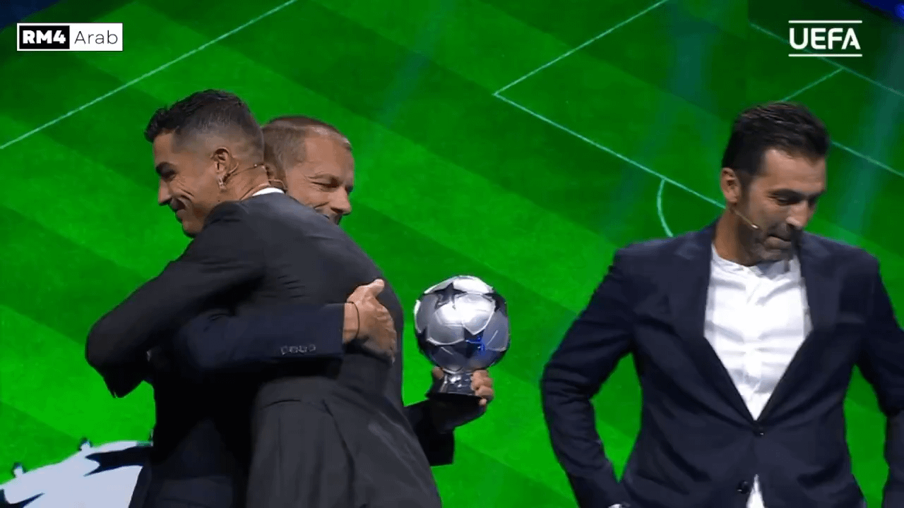 Ronaldo having a look at his award for being the all-time Champions League top scorer