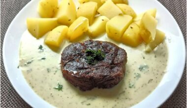 Beef tenderloin, new potatoes and dill sauce with cream.
