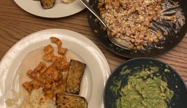 prawn tacos with saffron rice, chargrilled courgette, cabbage slaw, esquites (corn) & guacamole