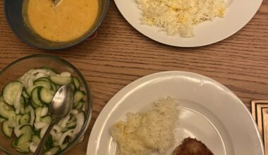 pork cutlet, saffron rice, japanese-inspired curry sauce, cucumber salad