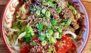 Homemade bowl with beef, rice noodles and chilli-ginger-lime sauce