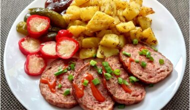 Roasted meatloaf with chili sauce, roasted potatoes with rosemary and garlic, peppers stuffed with cabbage and barbecue sauce.