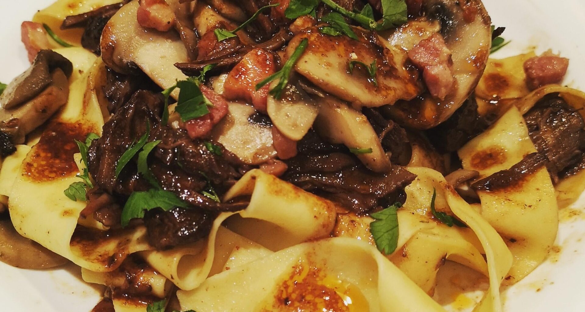 slow-cooked beef short ribs with mushroom and pancetta and red wine sauce