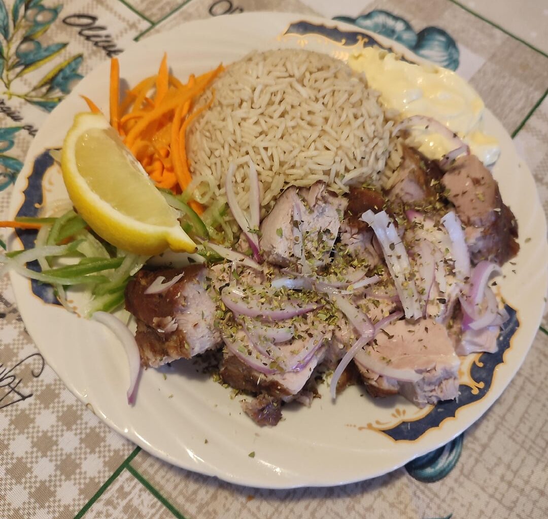 Pork neck and rice cooked in the meat's juices