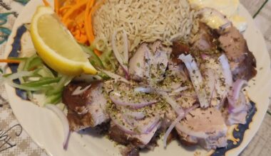 Pork neck and rice cooked in the meat's juices