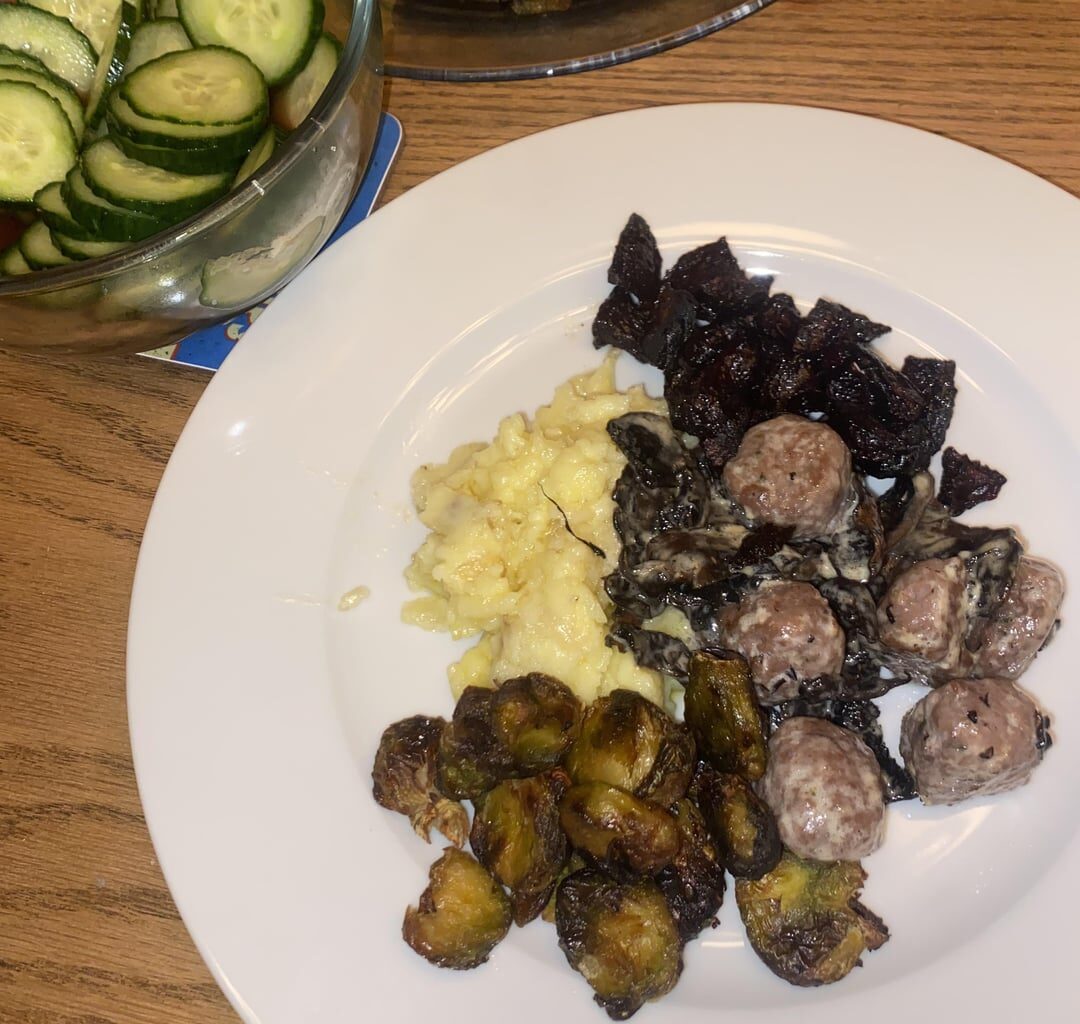 meatballs & mushrooms in a light cream sauce with mashed potato, roasted brussels sprouts & beets, and pickled cucumbers