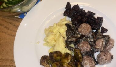 meatballs & mushrooms in a light cream sauce with mashed potato, roasted brussels sprouts & beets, and pickled cucumbers
